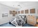 Bedroom with golf ball display, ceiling fan, window, and a comfy bed at 25 Bentley Ct., Pawleys Island, SC 29585