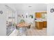 Bright dining area with tile floors, round table, and sliding glass doors at 25 Bentley Ct., Pawleys Island, SC 29585