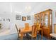 Traditional dining room with wooden table, chairs, and hutch under a crystal chandelier at 25 Bentley Ct., Pawleys Island, SC 29585