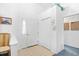 Bright entryway with tile flooring, white walls, and a coat closet for convenient storage at 25 Bentley Ct., Pawleys Island, SC 29585