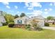 Charming single-story home with landscaped front yard, flowerbeds, and a two-car garage at 25 Bentley Ct., Pawleys Island, SC 29585