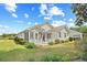 Well-maintained home exterior with landscaped yard, screened porch and wooden deck at 25 Bentley Ct., Pawleys Island, SC 29585