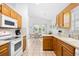 Open concept kitchen with tile floor and view of the adjacent dining area at 25 Bentley Ct., Pawleys Island, SC 29585