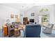 Cozy living room features vaulted ceilings, comfortable seating, and large windows for natural light at 25 Bentley Ct., Pawleys Island, SC 29585