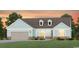Charming single-story home featuring an attached garage, dormers, and welcoming front lawn and well manicured landscaping at 259 River Edge Dr., Myrtle Beach, SC 29588