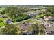 Aerial view of the townhome community with lush tree coverage and nearby commercial development at 3015 Old Bryan Dr. # 9-7, Myrtle Beach, SC 29577