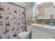 Nautical themed bathroom with lighthouse decor, patterned shower curtain, and modern fixtures provides a unique touch at 3015 Old Bryan Dr. # 9-7, Myrtle Beach, SC 29577