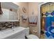 Bathroom includes a white sink vanity, tile accents, a toilet, and patterned shower curtain at 3015 Old Bryan Dr. # 9-7, Myrtle Beach, SC 29577