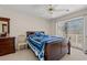 A cozy bedroom with a nautical theme, featuring a comfortable bed, dresser, and sliding glass doors at 3015 Old Bryan Dr. # 9-7, Myrtle Beach, SC 29577