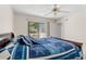 Comfortable bedroom with nautical theme features a queen bed and sliding glass doors leading to an outdoor patio at 3015 Old Bryan Dr. # 9-7, Myrtle Beach, SC 29577