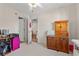 Bright bedroom with doors leading to other rooms, features a wooden cabinet at 3015 Old Bryan Dr. # 9-7, Myrtle Beach, SC 29577