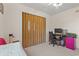 Cozy bedroom features a closet with folding doors, desk and ceiling fan at 3015 Old Bryan Dr. # 9-7, Myrtle Beach, SC 29577