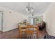Dining area with wood table, chairs, chandelier, and hardwood floors at 3015 Old Bryan Dr. # 9-7, Myrtle Beach, SC 29577