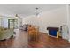 Well-lit dining area with hardwood floors and an open layout connecting to the living space at 3015 Old Bryan Dr. # 9-7, Myrtle Beach, SC 29577