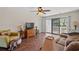 Comfortable living space with hardwood floors, ceiling fan, and sliding glass doors leading to outdoor views at 3015 Old Bryan Dr. # 9-7, Myrtle Beach, SC 29577