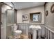 Clean and modern bathroom with shower, toilet, and pedestal sink, perfect for personal care at 329 46Th Ave. N, North Myrtle Beach, SC 29582