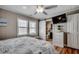 Bedroom featuring a TV, a sliding barn door to the bathroom, and a comfortable bed at 329 46Th Ave. N, North Myrtle Beach, SC 29582