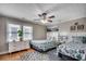 Bright bedroom with hardwood floors, two twin beds, and ample natural light from two large windows at 329 46Th Ave. N, North Myrtle Beach, SC 29582