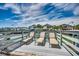 Deck furnished with sun loungers overlooking waterfront and waterfront neighborhood at 329 46Th Ave. N, North Myrtle Beach, SC 29582