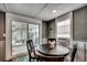 Cozy dining area with round table, chairs, and sliding door, perfect for small gatherings at 329 46Th Ave. N, North Myrtle Beach, SC 29582