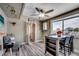 Inviting dining area with a ceiling fan, a water view, and a quaint table set for a cozy meal at 329 46Th Ave. N, North Myrtle Beach, SC 29582