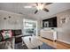 Living room with a large TV, comfortable sectional sofa, stylish decor, and ample seating at 329 46Th Ave. N, North Myrtle Beach, SC 29582