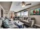 Bright and airy living room with comfortable seating, large windows, and a connection to the dining area at 329 46Th Ave. N, North Myrtle Beach, SC 29582