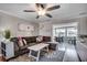 Comfortable living room with a large sectional sofa, ceiling fan, and an open layout at 329 46Th Ave. N, North Myrtle Beach, SC 29582