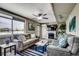 Relaxing living room with a fireplace, comfortable sofas, a large window, and stylish decor at 329 46Th Ave. N, North Myrtle Beach, SC 29582