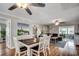 Cozy living room with a dining area, wood floors, coastal decor, and a comfortable seating arrangement at 329 46Th Ave. N, North Myrtle Beach, SC 29582