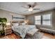 Comfortable bedroom with a queen bed, soft natural lighting, and stylish coastal-themed decor at 329 46Th Ave. N, North Myrtle Beach, SC 29582