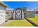 Backyard with a storage shed, privacy fence and well-maintained lawn at 349 Robin Hood Circle, Little River, SC 29566