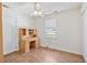 Bright bedroom featuring hard wood floors, a ceiling fan and a wooden desk with storage at 349 Robin Hood Circle, Little River, SC 29566