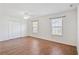Spacious bedroom featuring new floors, white walls, ceiling fan, and double door closet at 349 Robin Hood Circle, Little River, SC 29566
