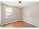 Small bedroom with hard wood flooring and window with blinds at 349 Robin Hood Circle, Little River, SC 29566