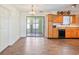 Eat-in kitchen and adjacent dining area with wood-look floors and sliding doors to an enclosed patio at 349 Robin Hood Circle, Little River, SC 29566