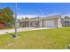 Charming single-story home with a well-maintained lawn, long driveway and attached two-car garage at 349 Robin Hood Circle, Little River, SC 29566