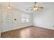 Inviting living room with wood-look floors, ceiling fan and lots of natural light from a window at 349 Robin Hood Circle, Little River, SC 29566