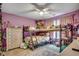 Purple bedroom with bunk beds, floral bedding, drawers and neutral carpet at 3613 Pitchers Pl., Little River, SC 29566