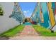 Unique alleyway with colorful murals and outdoor seating, offering an artistic and inviting urban space at 364 Hayloft Circle, Conway, SC 29526