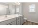 Bathroom features double sink vanity, vinyl floor, a mirror and walk-in shower at 364 Hayloft Circle, Conway, SC 29526