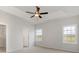 Spacious bedroom features tray ceiling, ceiling fan, two windows and carpeted floor at 364 Hayloft Circle, Conway, SC 29526
