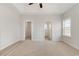Large bedroom boasts tray ceiling, neutral walls and carpet, closet and bathroom access at 364 Hayloft Circle, Conway, SC 29526