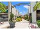 Charming garden walk featuring vibrant flowers, decorative butterflies, and American flags at 364 Hayloft Circle, Conway, SC 29526