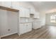 Modern kitchen boasts white cabinets, granite countertops, and stainless steel appliances at 364 Hayloft Circle, Conway, SC 29526
