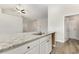 Kitchen island features granite countertop, stainless sink, faucet and white cabinetry at 364 Hayloft Circle, Conway, SC 29526