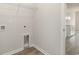 Laundry area with white walls, hardwood floor and wire shelf at 364 Hayloft Circle, Conway, SC 29526