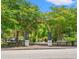 Picturesque Riverwalk entrance featuring lush greenery and decorative metal archway on a sunny day at 364 Hayloft Circle, Conway, SC 29526