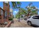 Charming street view with moss-covered trees and historic brick buildings on a sunny day at 364 Hayloft Circle, Conway, SC 29526