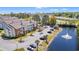 Scenic aerial view featuring community buildings, parking areas, and pond with fountain at 3741 Block House Way # 736, Myrtle Beach, SC 29577